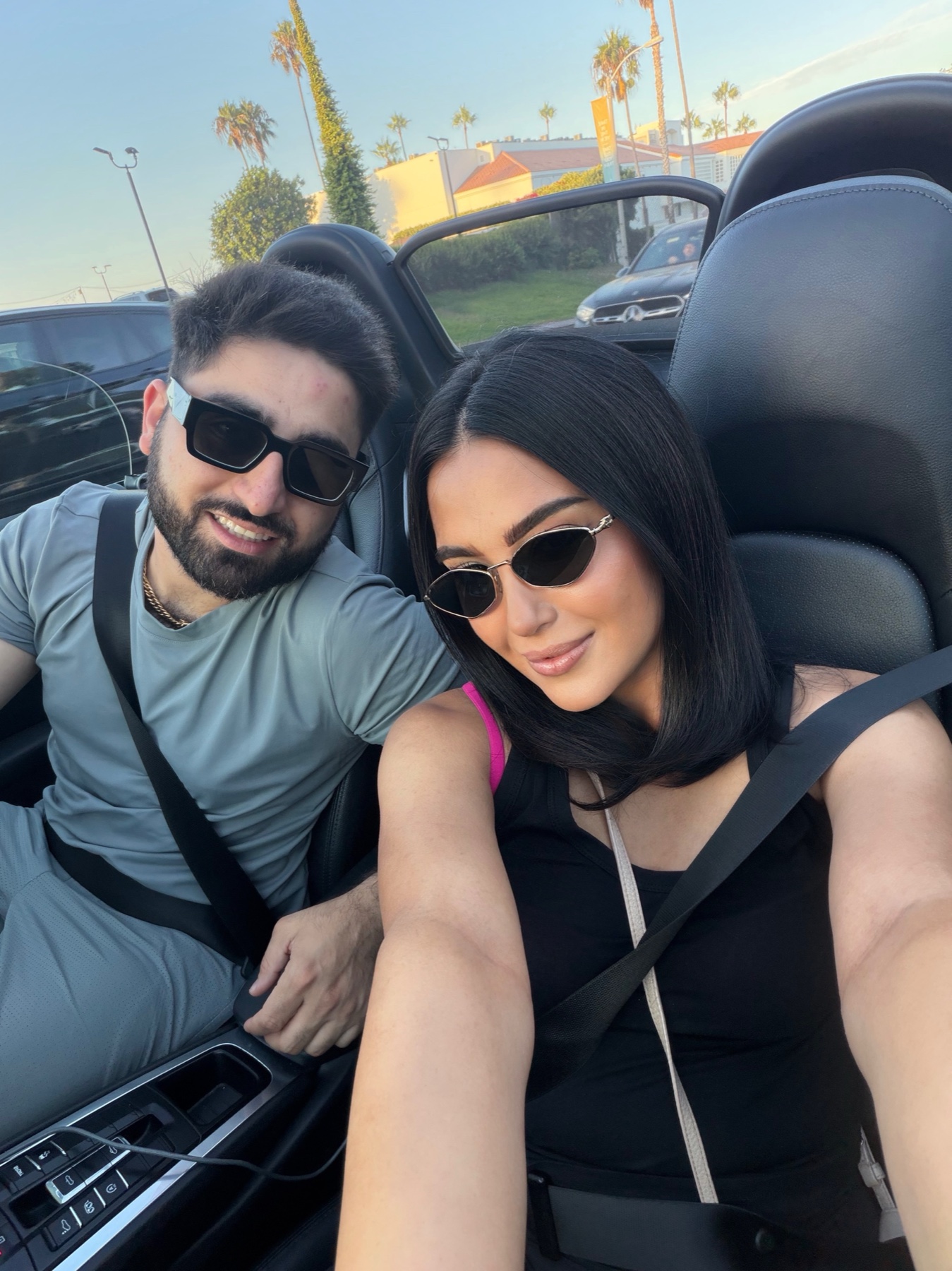 Nejla and me smiling together in a convertible